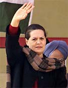 Congress President Sonia Gandhi waves to her supporters during a rally