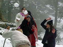 Tourists throw snowballs at each other at Kufri on Wednesday.