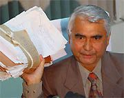 Chief Director of the Punjab Vigilance Bureau Mohammad Izhar Alam shows documents pertaining to the case registered against IAS officer