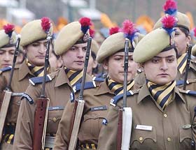 A contingent of the Jammu and Kashmir women police takes part in a rehearsal at Bakshi Stadium in Srinagar on Saturday.