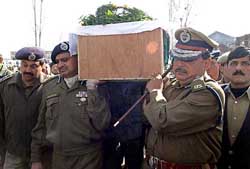 Director General of Police Gopal Sharma and Inspector General of Police K. Rajendra carry the coffin of slain Deputy Inspector General of Police Mohammad Amin Bhat