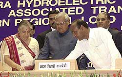 Prime Minister A.B. Vajpayee and Union Power Minister Anant G. Geete and Union Power Minister for State Jayawanti Mehta press the buttons to dedicate three power projects to the nation 
