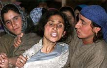 A relative cries over the killing of Samreena Jan (18) after an attack on Kashmir's Chief Minister Mufti Mohammad Sayeed in Beerwah, 40 km west of Srinagar 