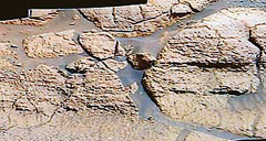 An image shown by NASA officials gives a detail of the planet Mars that they claim shows evidence that parts of the planet were once covered in water.