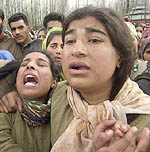 Relatives of Mohammad Shaban wail during his funeral in Wabwan on Wednesday. 