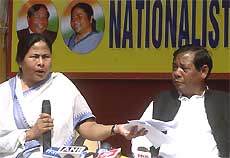 All-India Trinamool Congress President Mamata Banerjee holds a sheaf of papers as she addresses a joint press conference with Nationalist Congress Party (NCP) leader P.A. Sangma 