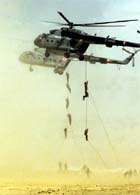 Indian commandos climb down from helicopters during the exercise Vayu Shakti 2004, at Pokhran firing range