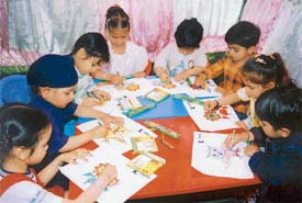 Children take part in a colouring contest at Cherryfields Nursery School