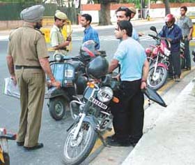 Youngsters run into trouble at a traffic police checkpoint in the Capital