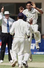 Anil Kumble celebrates with teammates as umpire Simon Taufel (left) declares Pakistans captain Inzamam-ul-Haq out during the third days play in the first Test match between India and Pakistan in Multan on Tuesday. 