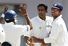 Anil Kumble (centre) celebrates with teammates Yuvraj Singh (right) and Akash Chopra after dismissing Pakistans Taufeeq Umar during the fourth days play in the first Test match in Multan 