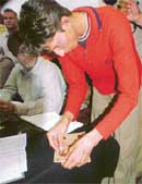 Makhan, a plus two student of Government Senior Secondary School, Mangat village, shows how he broke the seal of a bundle of question papers during a press conference in Ludhiana on Wednesday