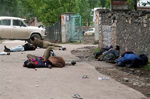 The dead and wounded lie on the road after an attack on an election campaign rally in Uri, 102 km east of Srinagar
