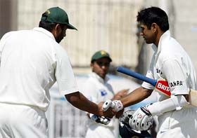 Rahul Dravid is congratulated by Pakistan captain Inzamam- ul-Haq after he reached his double century
