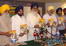 The SAD President, Mr Parkash Singh Badal, accompanied by senior leaders, releases the party manifesto in Ludhiana on Wednesday. 