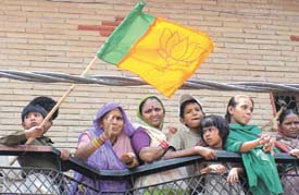 A child carrying the BJP flag during a campaign for East Delhi BJP candidate Lal Bihari Tiwari in the Capital on Friday.
