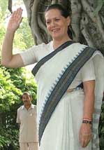 Sonia Gandhi poses for photographers at her residence