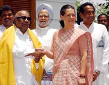 Congress Party President Sonia Gandhi with DMK party leader M Karunanidhi after a meeting in New Delhi on Sunday
