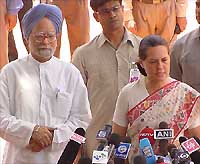 Congress President Sonia Gandhi with Dr Manmohan Singh talking to the media in the forecourt of Rashtrapati Bhavan after a meeting with the President, Dr A.P.J. Abdul Kalam, in New Delhi on Tuesday. 