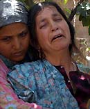 Relatives of four-year-old Sajad Ahmad wail before his funeral in Pharawara, 25 km south of Srinagar, on Thursday. 