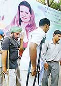 Dismissed physically challanged employees of the Punjab Government wait outside the residence of Congress President Sonia Gandhi in the Capital on Saturday. 
