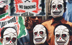Children wear masks at a roadside demonstration protesting against the use of tobacco on the occasion of World No Tobacco Day in Kolkata on Monday. According to WHO not only does tobacco use kill 4.9 million people each year, but it also contributes to poverty through loss of income, loss of productivity, disease and death. 