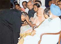 Mr Justice R. C. Lahoti takes blessings from his mother after his swearing-in ceremony as Chief Justice of India at Rashtrapati Bhavan in New Delhi on Tuesday.