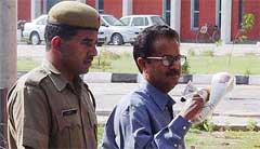 Former Home Secretary of Arunachal Pradesh Dharam Chand Sankhla being produced in a CBI court in Ambala