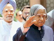 The President, Dr A.P.J. Abdul Kalam, gestures as he arrives for the joint session of Parliament along with Prime Minister Manmohan Singh