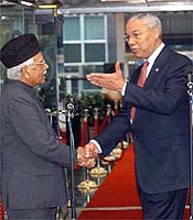 Foreign Minister Natwar Singh shakes hands with US Secretary of State Colin Powell at the State Department in Washington