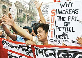 Activists of the Socialist Unity Centre of India (SUCI) stage a demonstration in Calcutta against the rise in fuel prices on Wednesday
