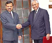 Additional Secretary of the International Organisation in the External Affairs Ministry Sheel Kant Sharma (left) shakes hands with his Pakistani counterpart, Mr Tariq Osman Haider, in New Delhi 