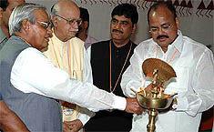 Former Prime Minister Atal Bihari Vajpayee lights the lamp to begin the proceedings of the three-day BJP National Executive in Mumbai on Tuesday. Also seen are Mr L.K. Advani, Mr Gopinath Munde and Mr Venkaiah Naidu. 