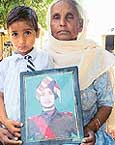 The mother and son of Lance Naik Jaskir Singh with his photograph. 