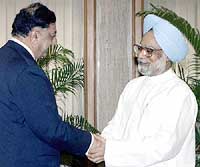 Prime Minister Manmohan Singh welcomes Pakistani Foreign Secretary Riaz Khokar before a meeting in New Delhi, on Monday. 