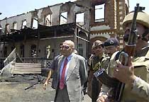 The Governor of Jammu and Kashmir, Lieut-Gen (retd) S. K. Sinha, inspects the gutted building of Islamia School in downtown Srinagar on Tuesday.