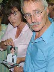 Trevor and Hilary Foster with the photograph of their daughter Hannah Foster