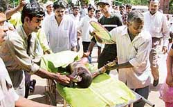 An injured child is taken to hospital after a fire broke out at a school in Kumbhakonam in Thanjavur district of Tamil Nadu on Friday.