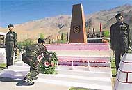 An Army officer lays wreath at the war memorial in Dras sector in the memory of the soldiers who laid down their lives in 1999 during Kargil war. 