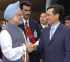 Prime Minister Manmohan Singh is received by Thai Deputy Prime Minister Chaturon Chaiisang at Royal Thai Air Force terminal in Bangkok on Thursday