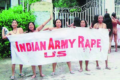 A group of Indian women shed their clothes and protest outside the Indian Army Assam Rifles anti-terrorism unit barracks in Imphal, Manipur.