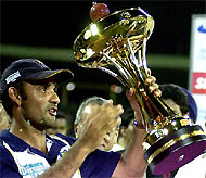 Sri Lanka captain Marvan Atapattu holds aloft the Asia Cup Trophy after Sri Lanka defeated India in the final at the R Premadasa Stadium on Sunday.
