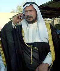 Sheikh Hisham al-Dulaimi, an Iraqi tribal leader, mediating with kidnappers for the release of seven kidnapped truck drivers, leaves a press conference in Baghdad