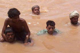 Villagers in neckdeep water at Rohar Jagir village, 35 km from Patiala