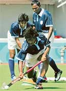 Members of the Indian hockey team practice their shots during a training session in Athens on Wednesday. The Athens 2004 Olympic Games will officially open on August 13. 