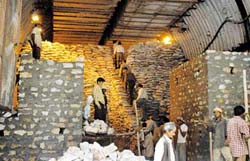 Sand bags are piled up at the NJPCs main gate in Rampur. 