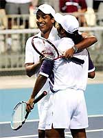 India's Mahesh Bhupathi and Leander Paes celebrate after defeating Zimbabwe's Wayne Black and Kevin Ullyet 6-4, 6-4 in the men's doubles quarterfinal of the Athens Olympics on Wednesday. 