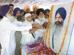 Harchand Singh Longowals sister Sham Kaur and other family members pay homage to the late leader on his death anniversary at Longowal in Sangrur district on Friday