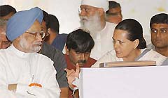 Prime Minister Manmohan Singh listens as Congress President Sonia Gandhi discusses a point with him during the AICC meeting in New Delhi on Saturday. 