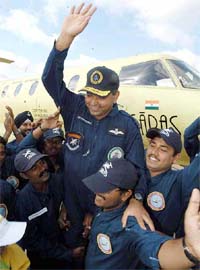 Chief pilot of Saras Sqn Ldr K.K. Venugopal is lifted by his crew members